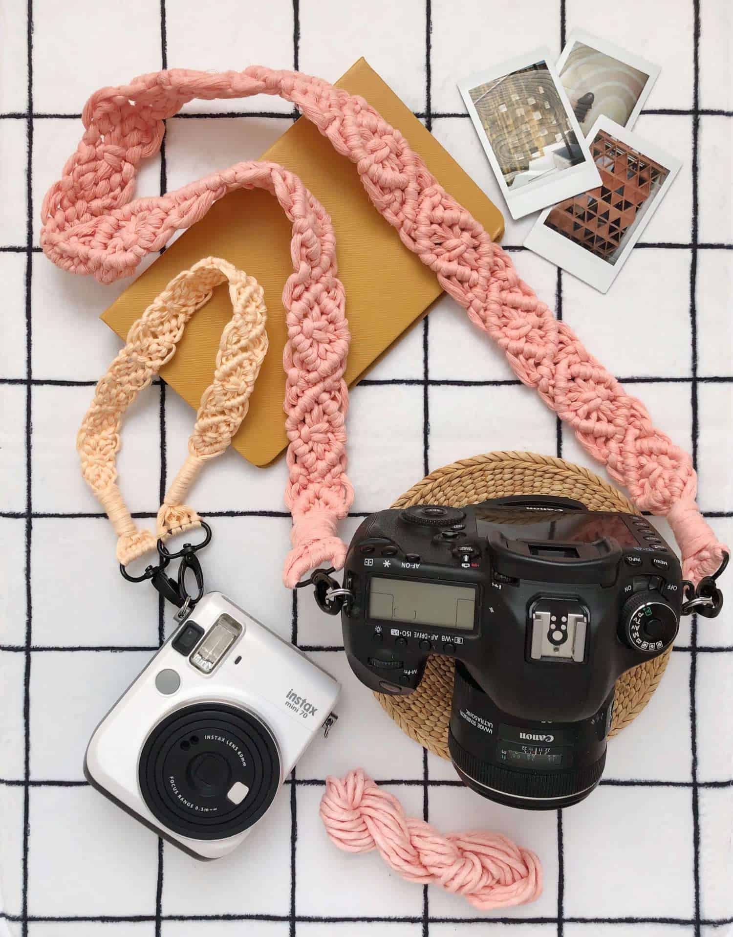 Macrame camera strap tutorial with two finished straps attached to cameras in soft blush cord.