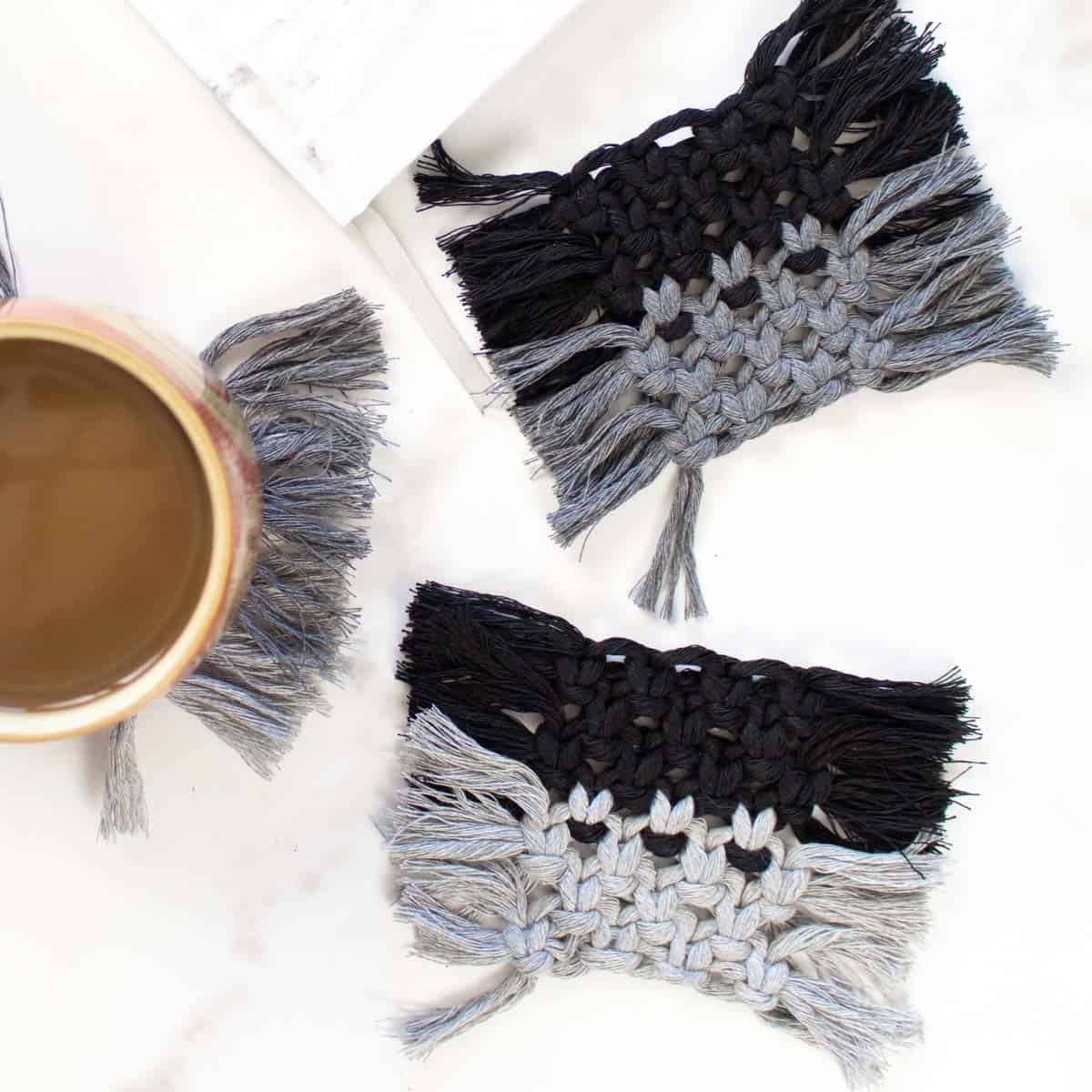 Macrame coaster tutorial with square fringe coasters in black, gray, and cream cotton cord.