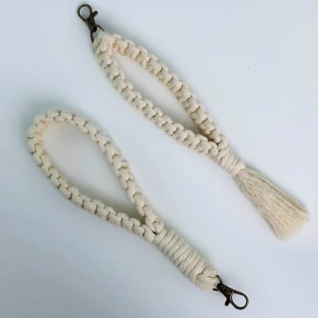 Easy macrame keychain tutorial with four colorful knotted tassel keychains and wrapped cord ends.
